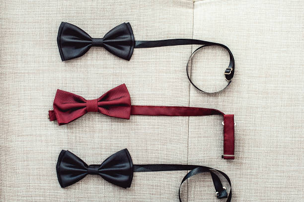 istock Three bow ties, two black and one red. Team work, career, hipster, wedding concept. 671061836