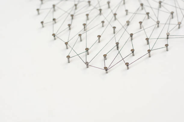 istock Linking entities. Network, networking, social media, internet communication abstract. A small network connected to a larger network. in paper linked together by cotton with a black tint 671065418