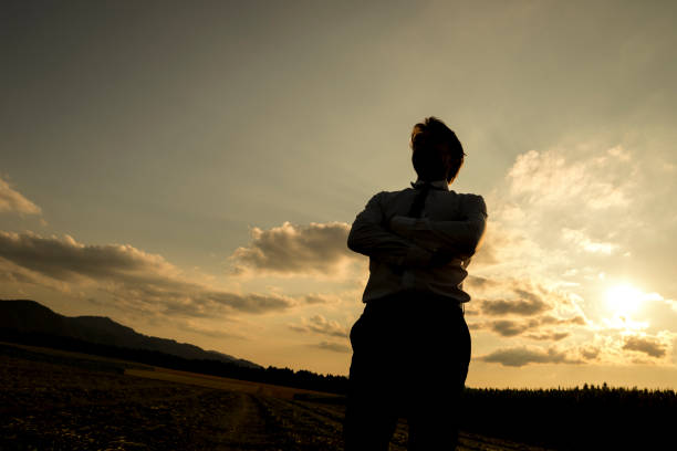 istock Silhouette of a man at sunset 671065762
