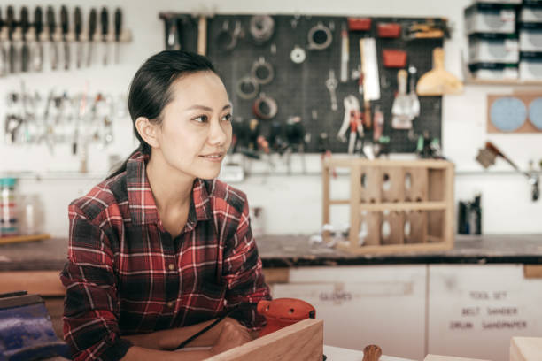 istock Furniture designer at woodworking studio 671065982
