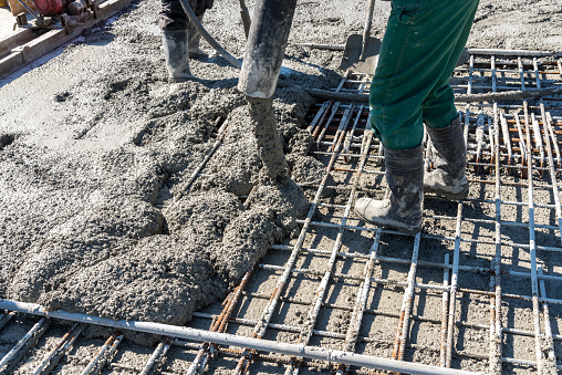 Close view on the concrete pouring on the construction site