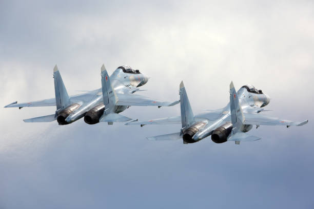 KUBINKA, MOSCOW REGION, RUSSIA - JUNE 17, 2015: Pair of Sukhoi Su-30SM RF-91815 jet fighters take off at Kubinka air force base during Army-2015 forum. stock photo
