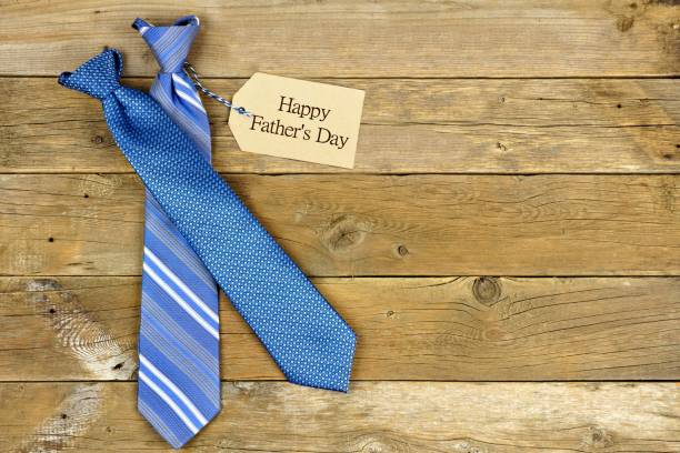 istock Fathers Day gift tag with ties on rustic wood 671080530