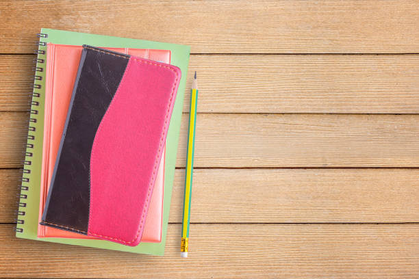 istock Notebooks and pencil on office desk or wood table 671081062