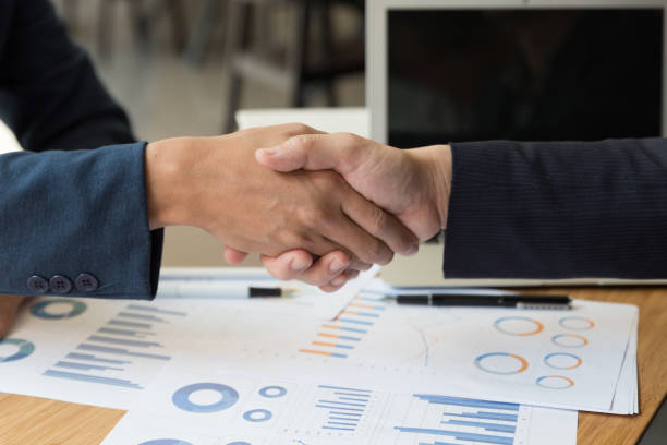 istock businessman handshaking after meeting in office - teamwork, cooperation, agreement, acquisition concept 671084380