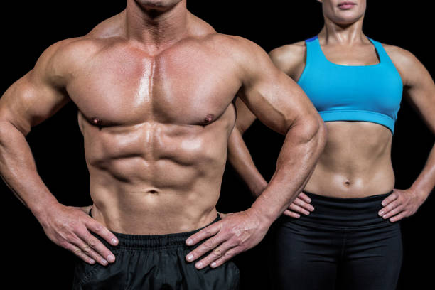 istock Midsection of man and woman with hands on hip 671084392