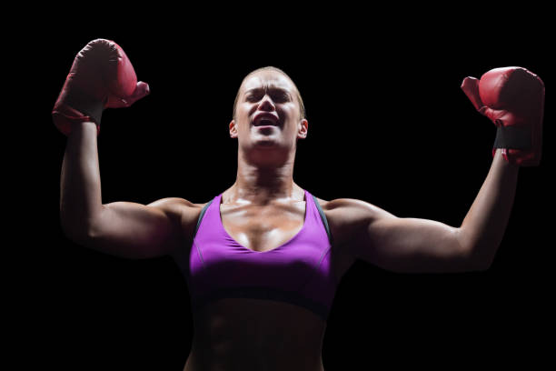 istock Winning woman cheering with arms raised 671095614