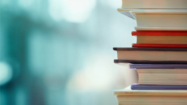 Business and education background Book stack in the library room and blurred bookshelf, business and education background book shop stock pictures, royalty-free photos & images