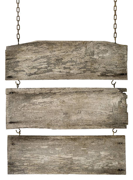 istock Three old weathered grungy wooden board signs linked together, hanging by old rusty chains. 671101244