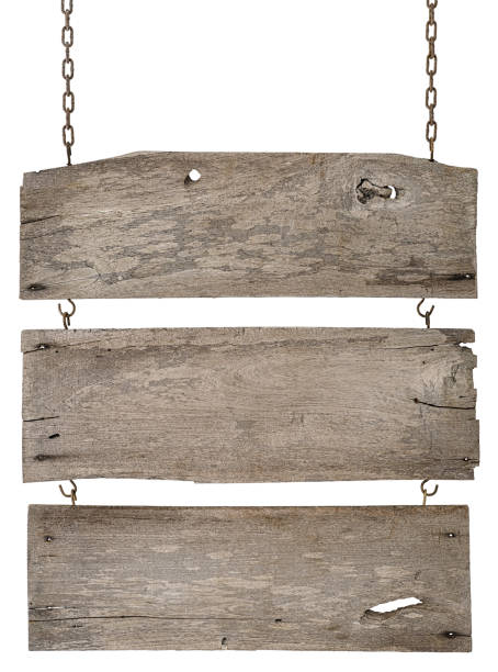 istock Three old weathered grungy wooden board signs linked together, hanging by old rusty chains. 671101246