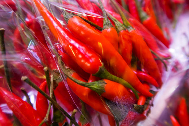 istock Chili peppers in the foreground 671101382