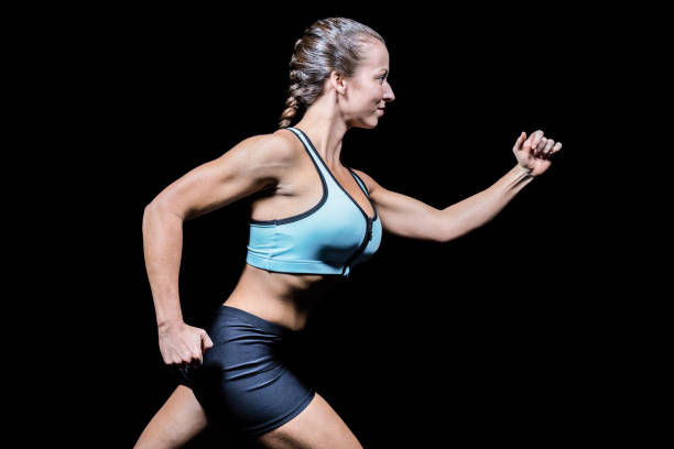 istock Side view of female athlete running 671118020
