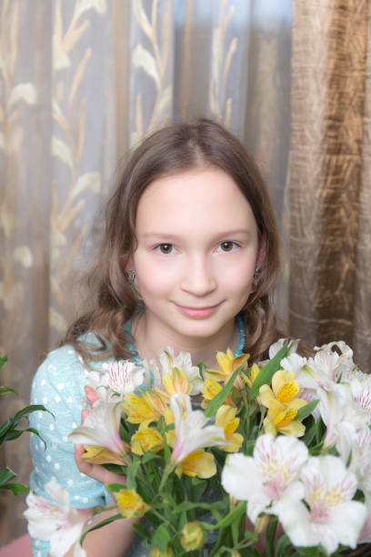 istock girl with flowers closeup 671120966