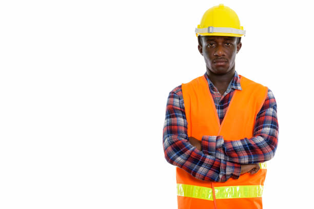 istock Studio shot of young black African man construction worker with arms crossed 671124820