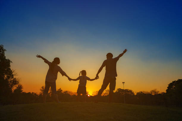 istock Family silhouette with sunset. 671129974