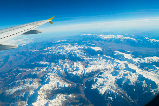istock Aerial view from the airplane window over the Alps 671132754