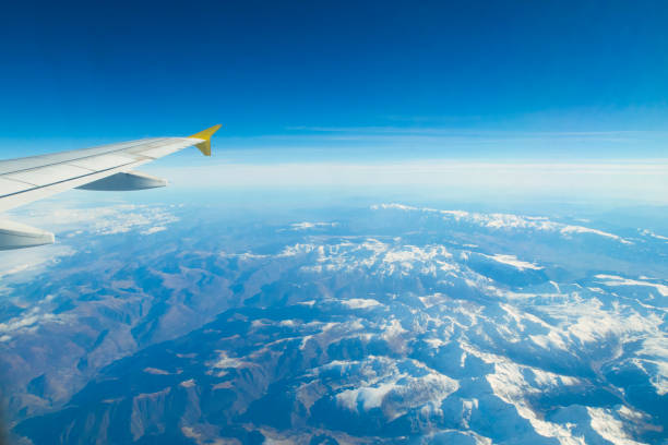 istock Aerial view from the airplane window over the Alps 671132898
