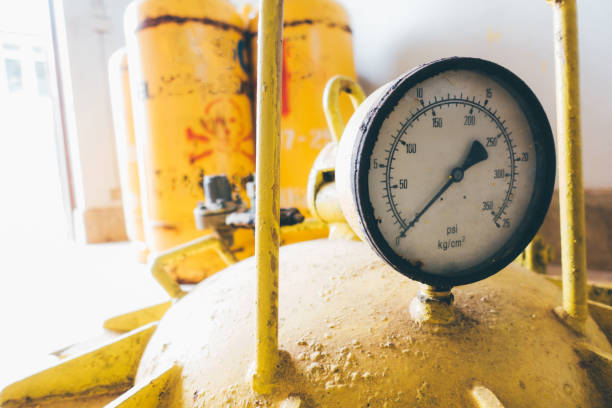 pressure gauges and valves of chlorine gas cylinders pressure gauges and valves of chlorine gas cylinders chlorine stock pictures, royalty-free photos & images
