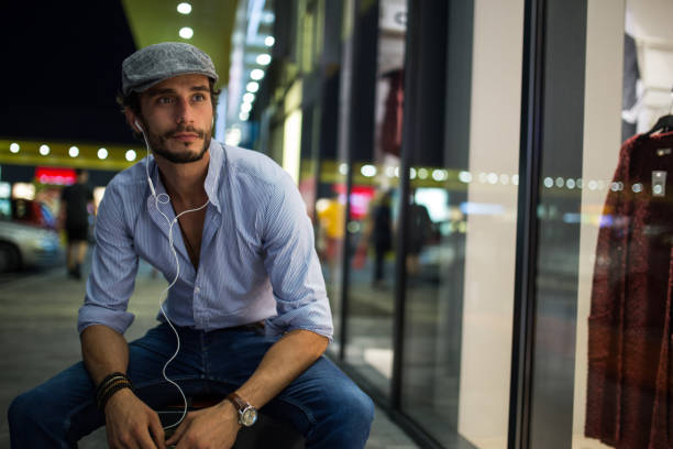 istock Man listening music outdoors 671135896