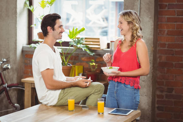 istock Colleagues laughing in bright office 671135952