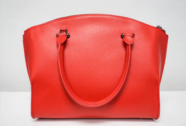 istock isolated light red woman bag 671136380