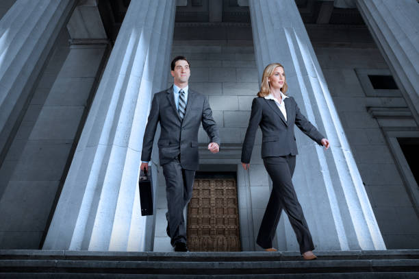 istock Lawyers Or Business People Leaving Courthouse 671136948
