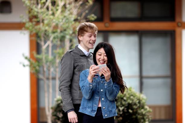 istock Couple shooting themselves at Japanese temple 671152492
