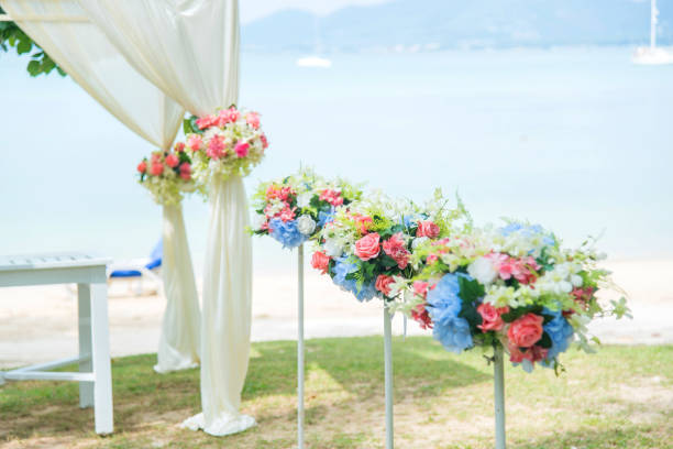 istock Flower decorated in wedding set up inside beach. 671152494