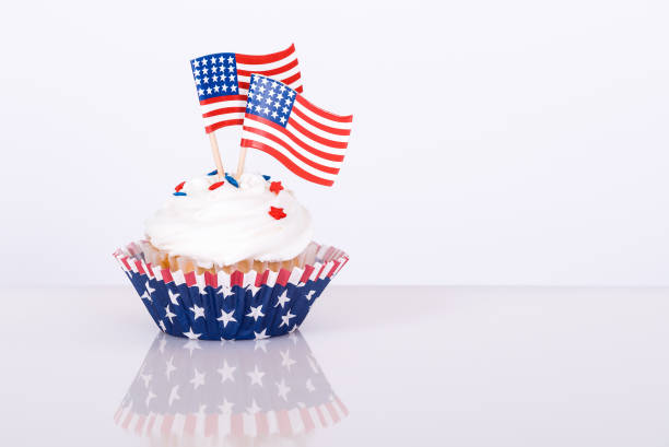 istock Patriotic cupcake with decorative American flags 671153532