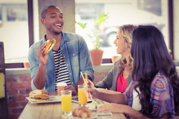 istock Happy business people having breakfast 671156900