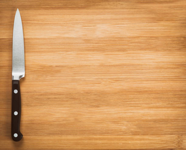 istock kitchen knife on a wooden background 671156948
