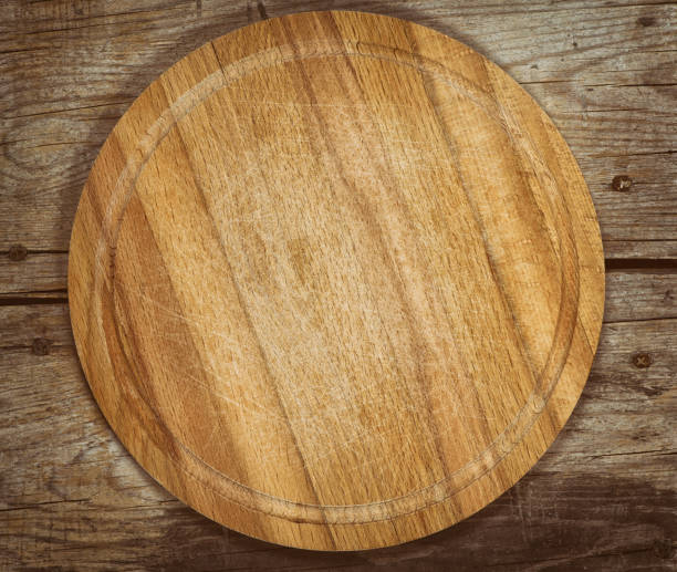 istock old cutting board on a wooden table 671159810
