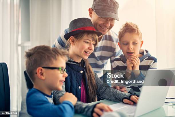 Father Having Fun Coding With Kids Stock Photo - Download Image Now - 10-11 Years, 6-7 Years, Adult