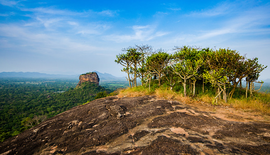 Sigiriya Rock towering above the Sri Lanka landscape, seen from Pidurangala Rock, Sri Lanka.