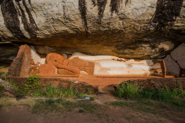 istock Ancient Buddha at Pidurangala Hill Cave Temple, Sigiriya 671167876