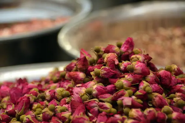 Dried whole rosebuds used in teas, soap-making, perfumes, aromatherapy, food decoration, food flavoring. Used in the Middle East, Turkey, Greece and North Africa. Natural lighting.