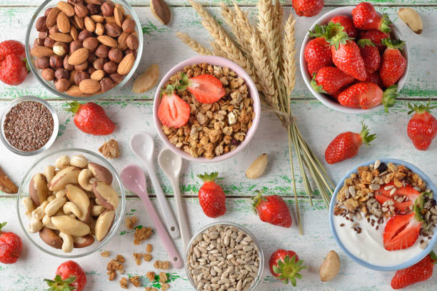 istock Muesli, nuts, yogurt and cereals on a white background 671183380
