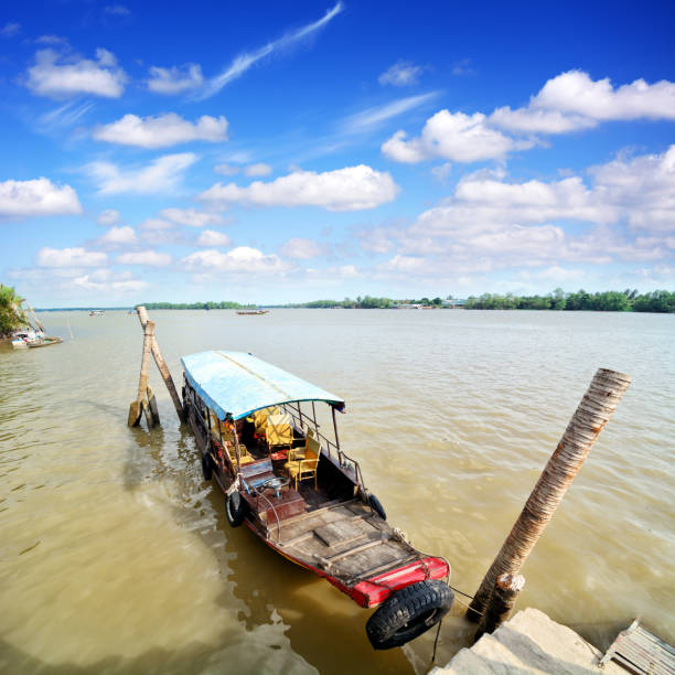 The front of a wooden boat  with a rope