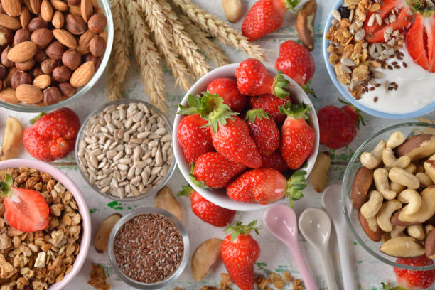 istock Muesli, nuts, yogurt and cereals on a white background 671183518