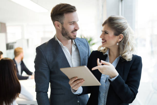 istock Professional business people cooperating in company office 671183584