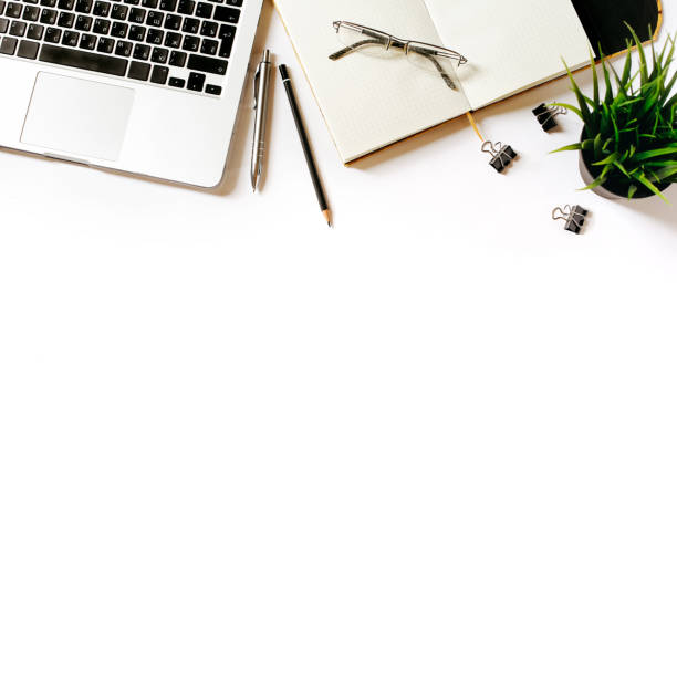 istock Modern minimalistic work place. White office desk table with laptop, clips, glasses, office plant, notebook, pen and pencil. Top view with copy space, flat lay 671186788