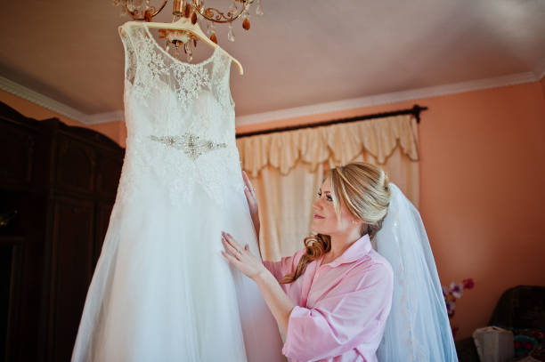 istock Bride looked at her wedding dress 671190122