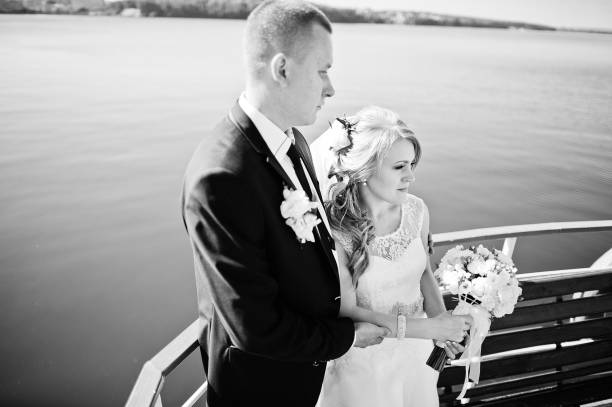 istock wedding couple on small boat ship 671193314