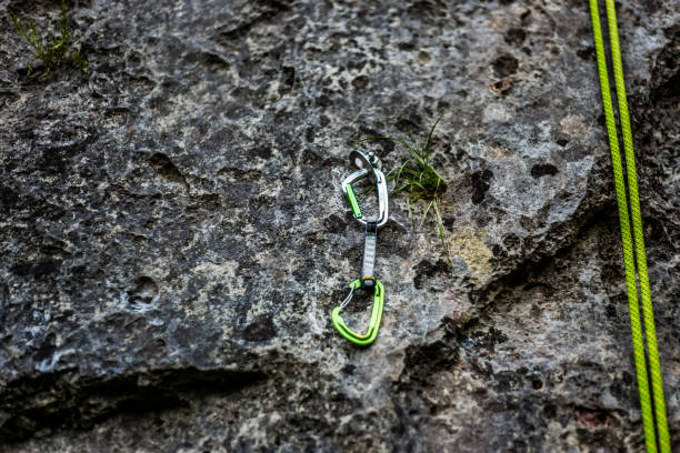 istock Rock climber carabiner, safety gear, rope, copy space 671195744