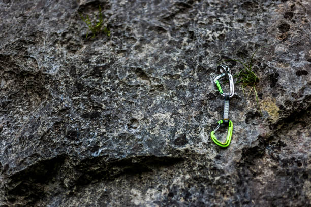 istock Rock climber carabiner, safety mountain gear, copy space 671196160