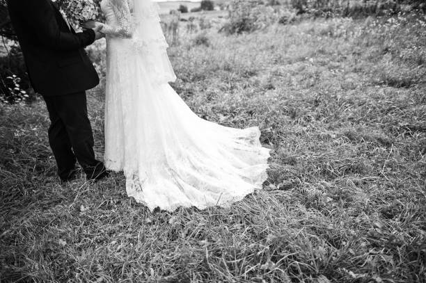 istock Wedding couple in high grass and near tree 671197198
