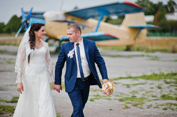 istock wedding couple background plane on airport 671199538