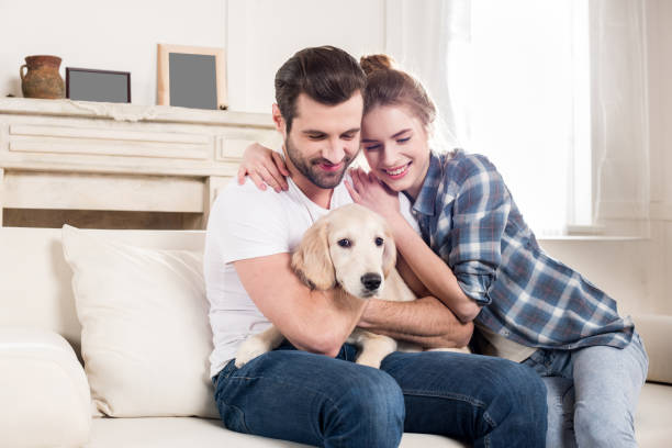 istock Young couple with puppy 671199610