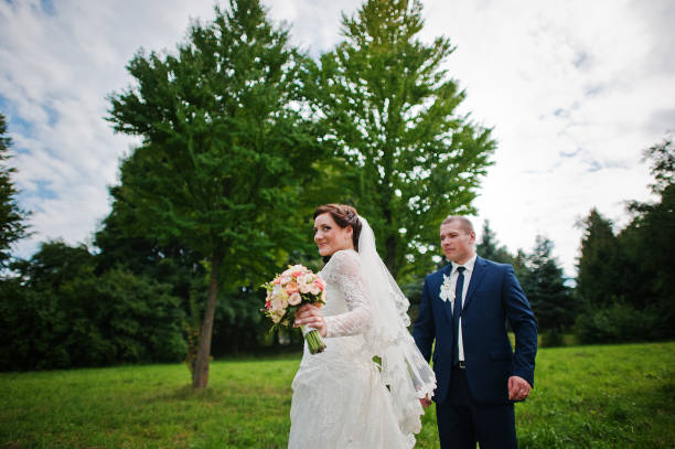 istock lovely newlywed at nature park square 671199790