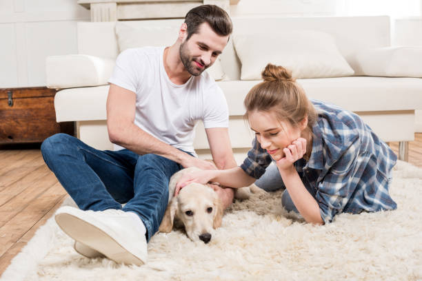 istock Young couple with puppy 671199900